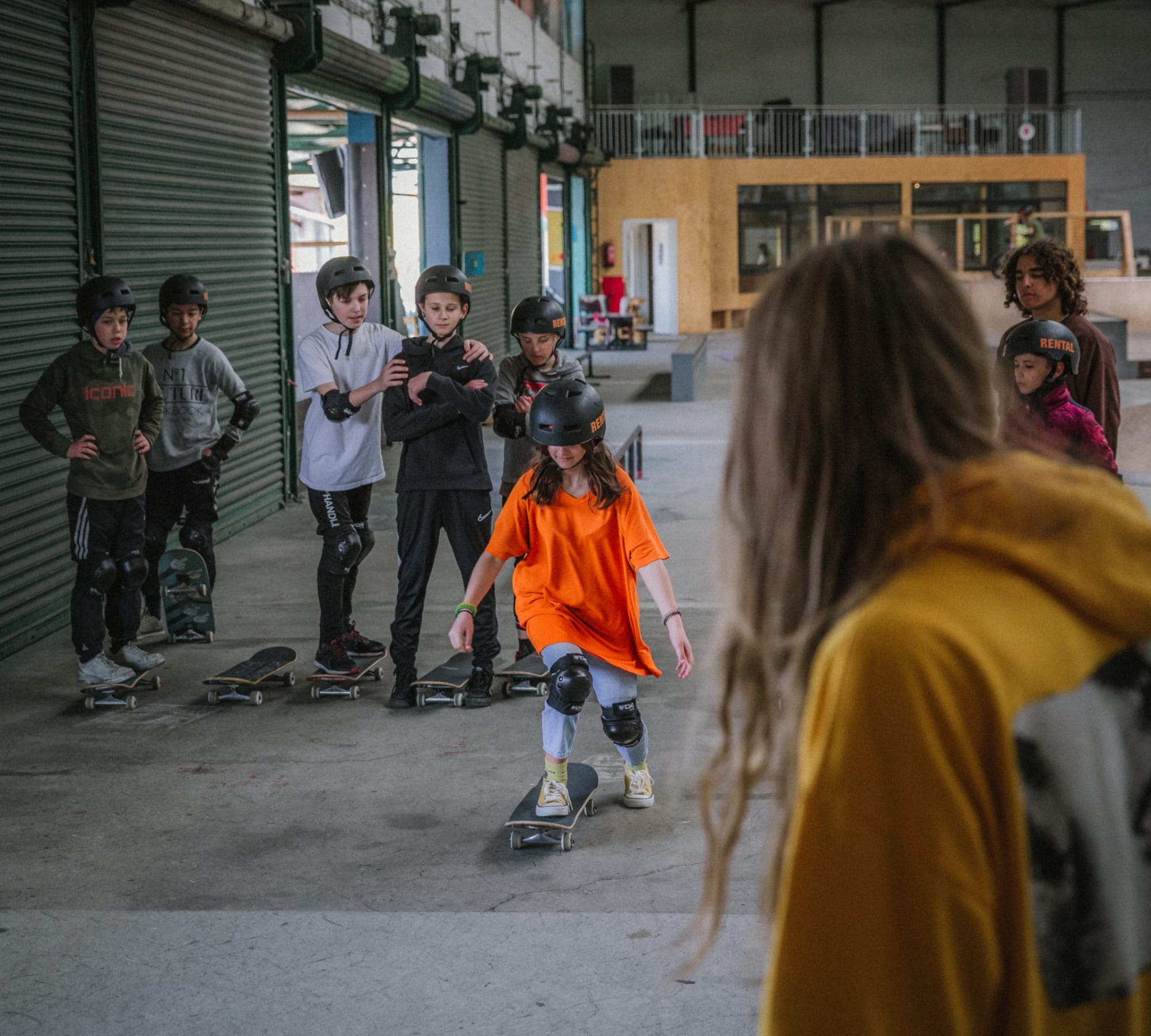 Yurii Korotun coaching a group of young skateboarders